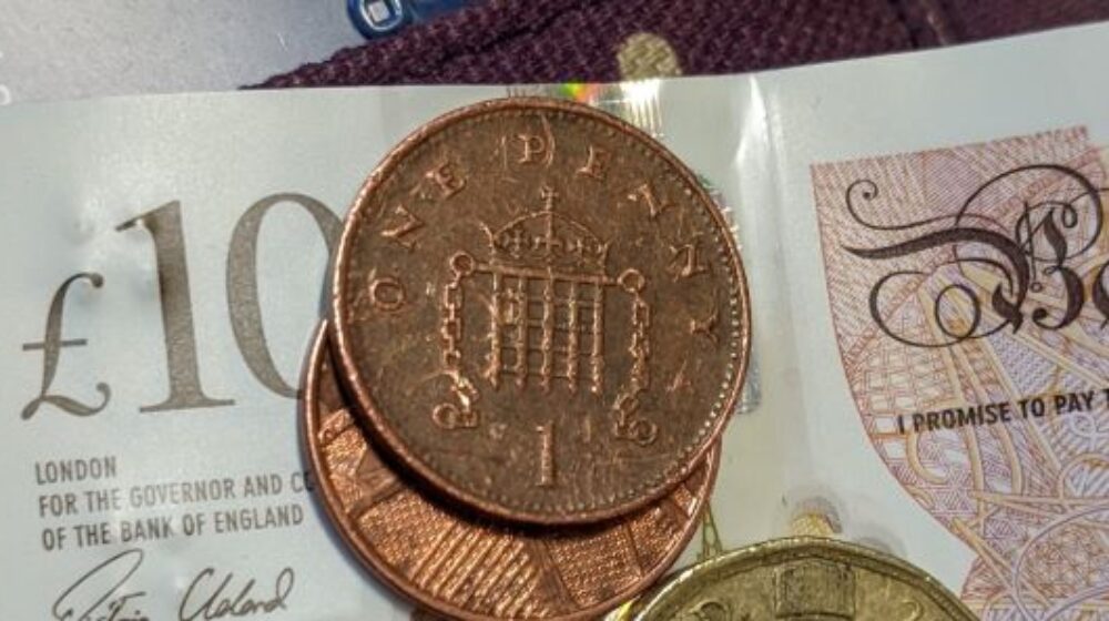 A ten pound note and some coins